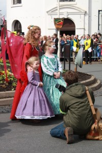 Photographer with costumed woman and 2 girls