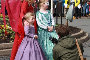Photographer with costumed woman and 2 girls